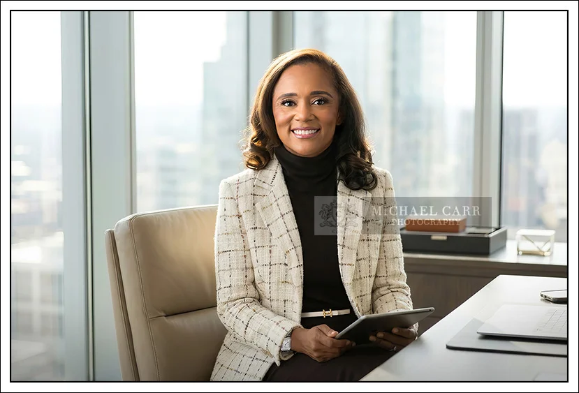 Female Corporate Headshots in Houston with a skyline background