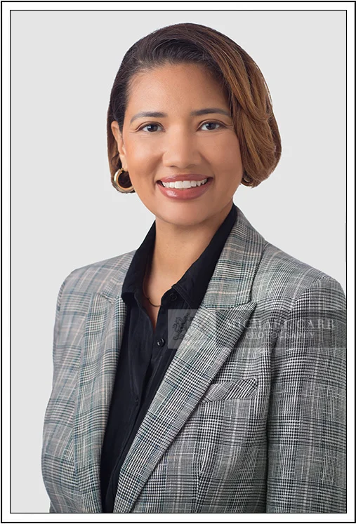 Classic corporate headshot of Houston businesswoman in gray jacket