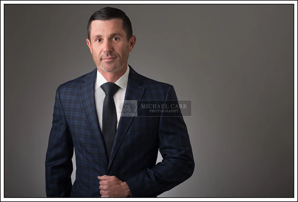 Houston Headshot Photographer Three-quarter length executive portrait of a business professional photographed in a Houston studio