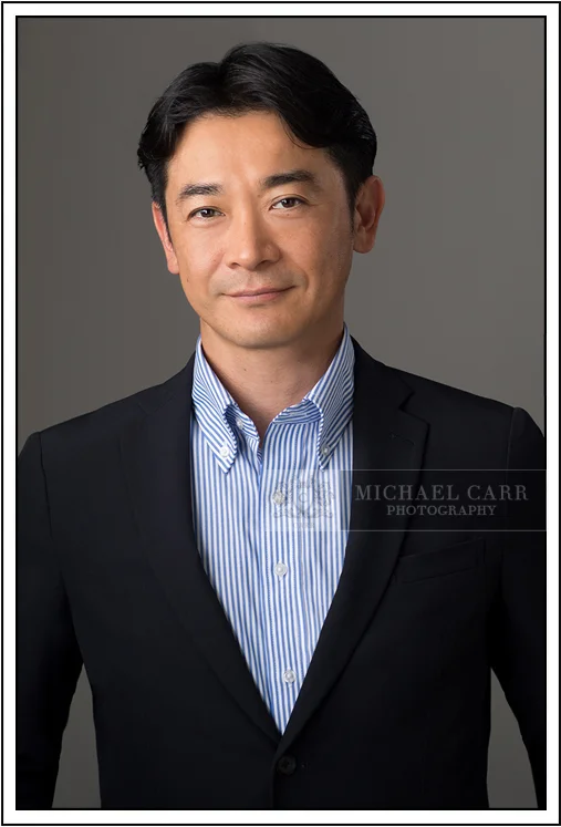 Houston Headshot Photographer Corporate portrait of a Houston business professional in a navy suit for executive branding and leadership profiles.