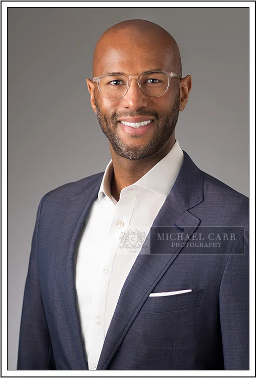 Houston Headshot Photographer Houston professional headshot with gray background