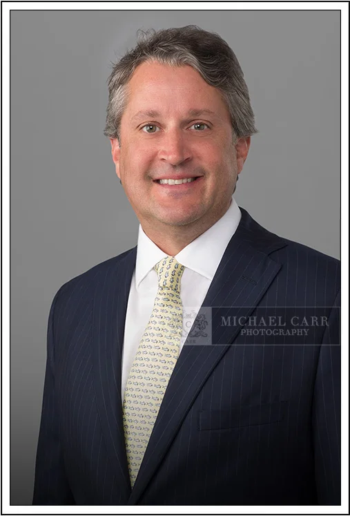 Houston Headshot Photographer Houston on-location executive portrait of businessman in blue suit