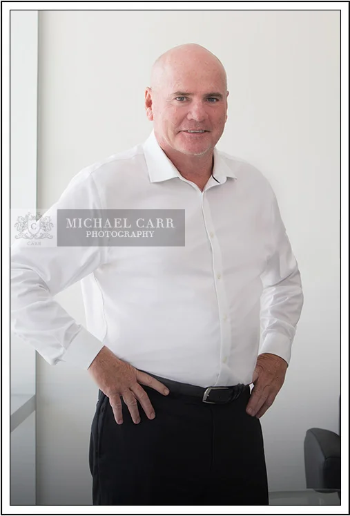 Houston Headshot Photographer Houston on-location executive headshot of businessman in white shirt