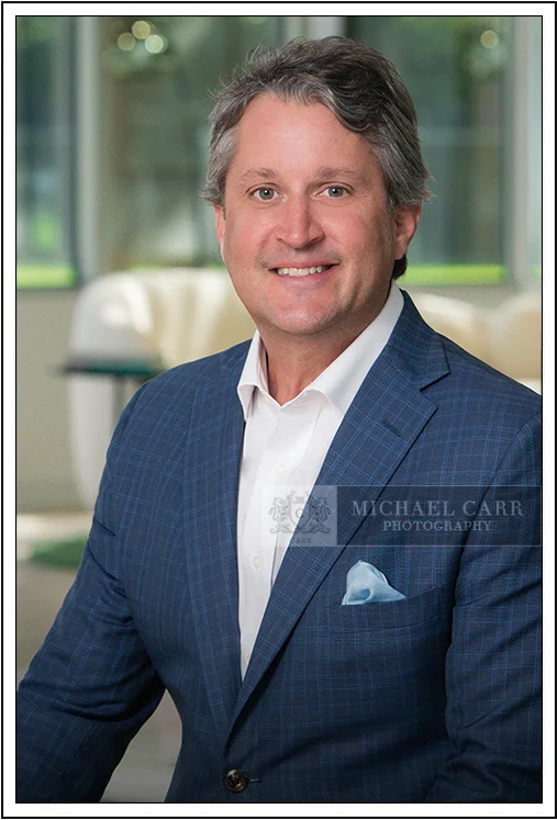 Houston Headshot Photographer Houston on-location executive portrait of businessman in blue suit