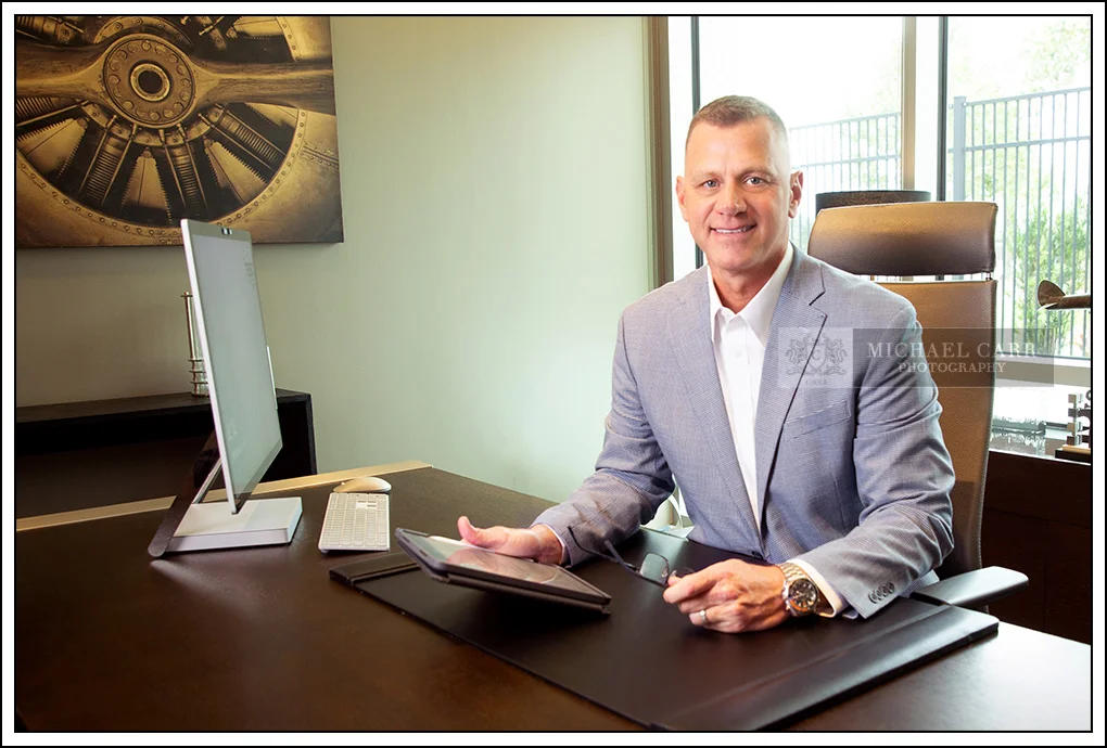Houston Headshot Photographer Houston On Location Executive Headshots executive portrait photographed on location in an office