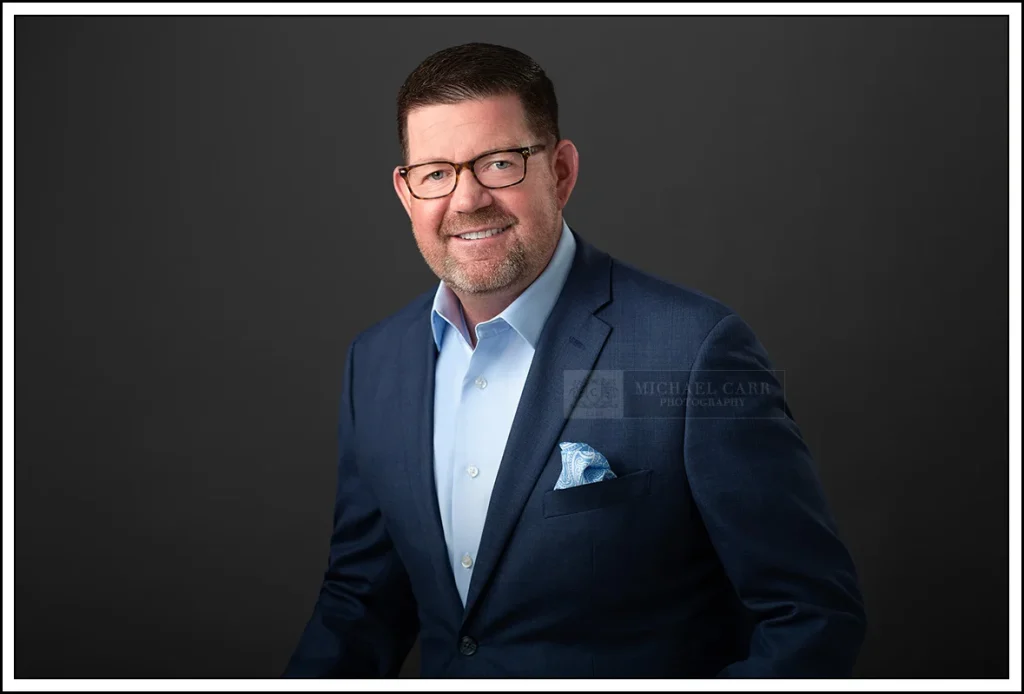Professional corporate headshot for Houston executive in studio
